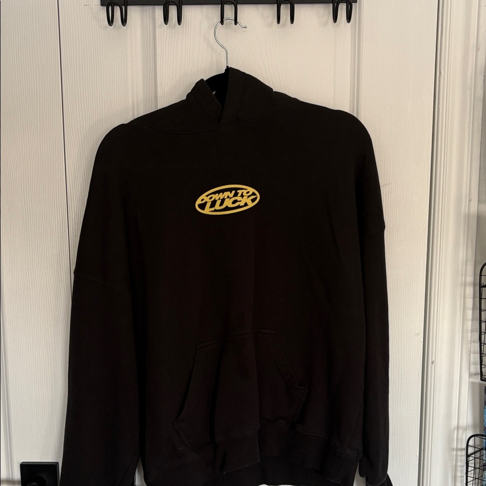 Black Hoodie with Yellow Graphic
Cold Culture